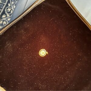 Gold Round Sunburst Charm letter “m”
Inscription